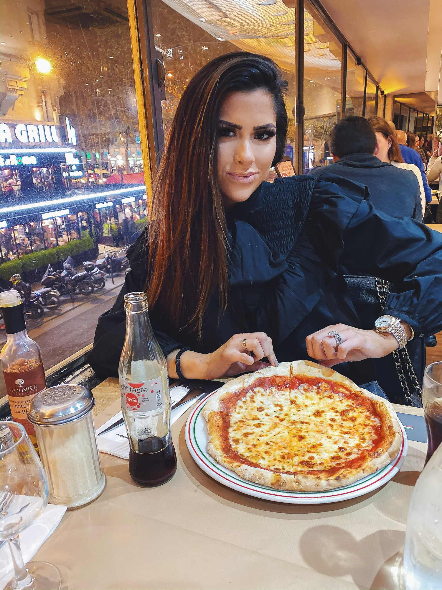 paris fashion outfit idea emily gemma | A YEAR IN REVIEW : MASSIVE 2019 INSTAGRAM RECAP by popular Oklahoma life and style blog, The Sweetest Thing: image of a woman eating pizza and wearing a black Zara top. 