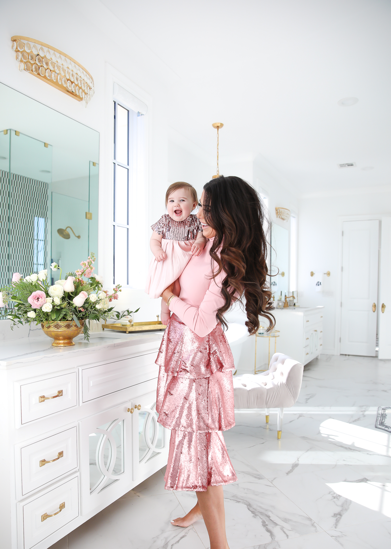 Sparkly Sequin Holiday Outfits by popular Oklahoma fashion blog, The Sweetest Thing: image of a mom and daughter in a bathroom wearing a Nordstrom Rachel Parcell Puff Shoulder Turtleneck, Nordstrom Rachel Parcell Tiered Sequin Skirt, Nordstrom Schutz Ariella Sandal, Nordstrom Chanel Crystal Hair Barrette, Nordstrom Charlotte Tilbury Lip Cheat Lip Liner, Nordstrom Charlotte Tilbury Hot Lips Lipstick, Nordstrom Tom Ford Gloss Luxe Moisturizing Lipgloss, and Nordstrom Bardot Junior Nolene Sequin Party Dress.