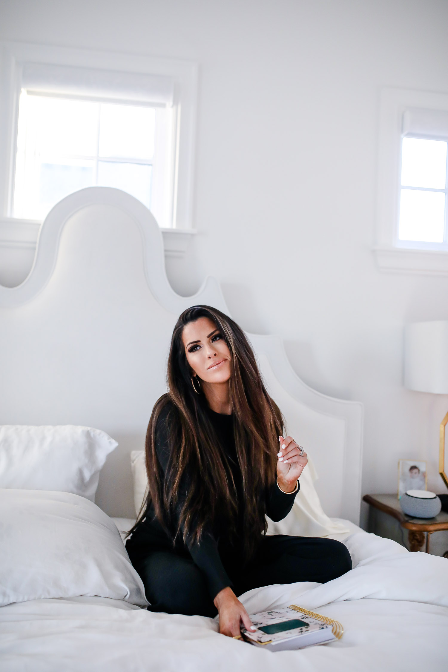 çverishop, verishop review, pinterest master bedroom inspo, emily gemma, hooker furniture nightstands-2 | Cozy Essentials by popular US fashion blog, The Sweetest Thing: image of a woman sitting on her bed and wearing a Verishop LETT Montreal Rib Top and Verishop LETT Heathrow Wide Leg Pant.
