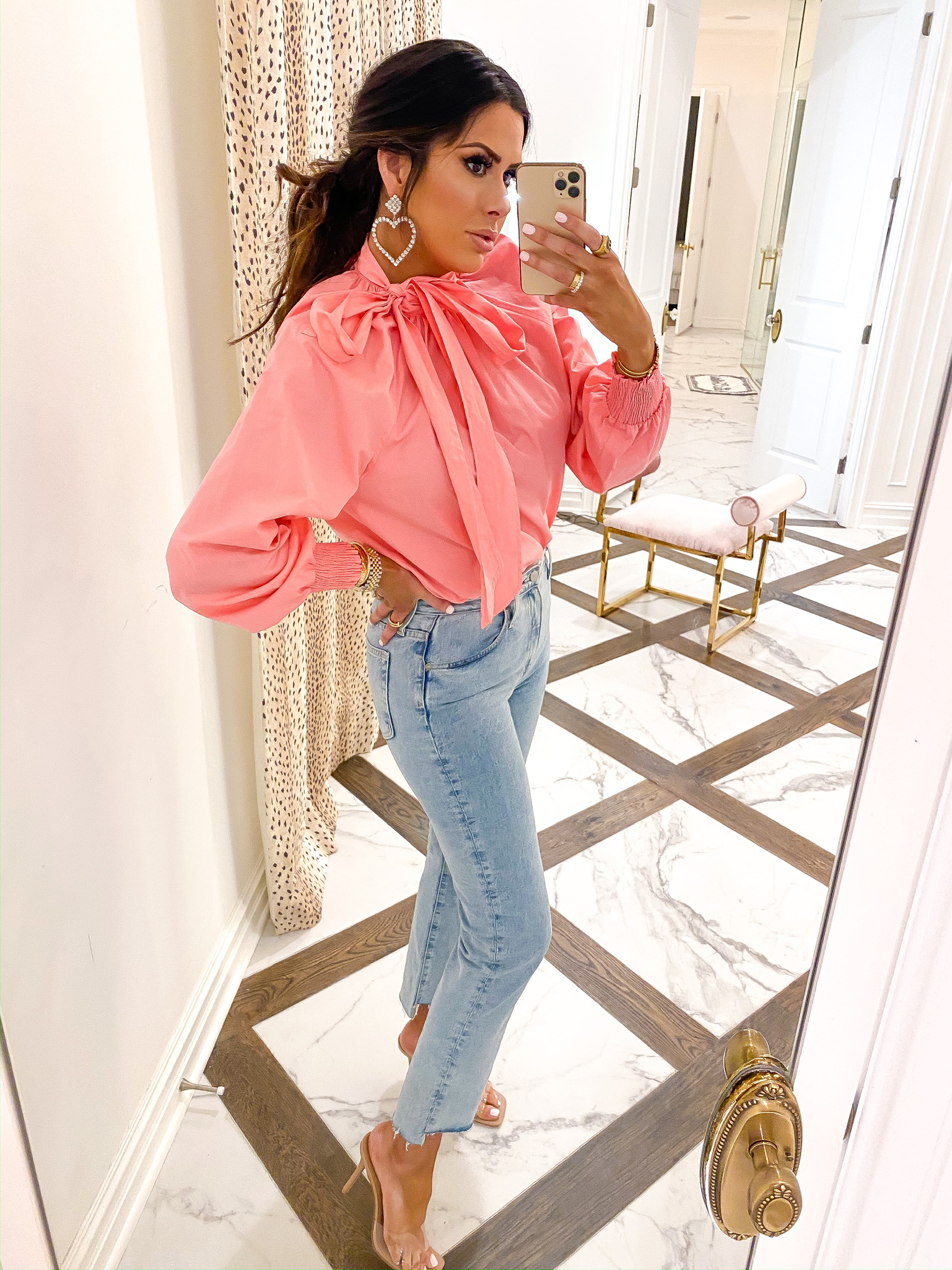 Instagram Fashion by popular US fashion blog, The Sweetest Thing: image of a woman wearing a Nordstrom Topshop Pussybow Poplin Blouse, Nordstrom The Isabelle High Waist Step Hem Ankle Jeans AG, ASOS True Decadence rhinestone crystal heart drop earrings, and Steve Madden SIGNAL CLEAR heels. 