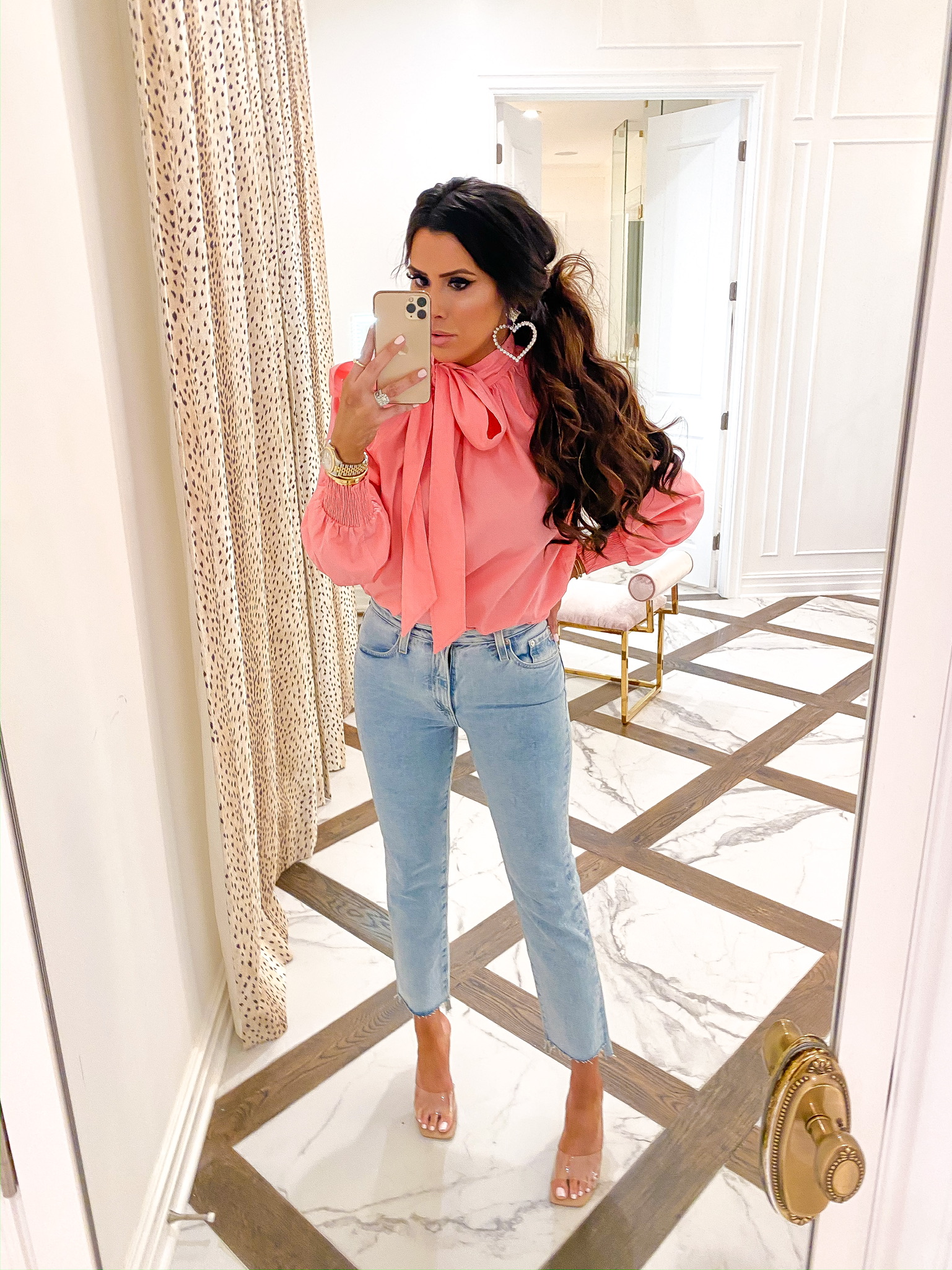 Valentine's Day Outfit Ideas by popular US fashion blog, The Sweetest Thing: image of a woman wearing a Nordstrom The Isabelle High Waist Step Hem Ankle Jeans AG, Nordstrom Pussybow Poplin Blouse TOPSHOP, Asos True Decadence rhinestone crystal heart drop earrings, and Steve Madden SIGNAL CLEAR.