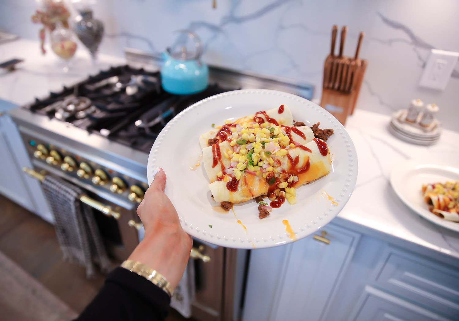 Home Chef review, home chef discount code 2020, emily gemma home chef code 2020, emily ann gemma |  BBQ Beef Enchiladas by popular US lifestyle blog, The Sweetest Thing: image of a woman wearing a Verishop LETT Montreal Rib Top and Verishop LETT Heathrow Wide Leg Pant and holding a plate of bbq beef enchiladas. 