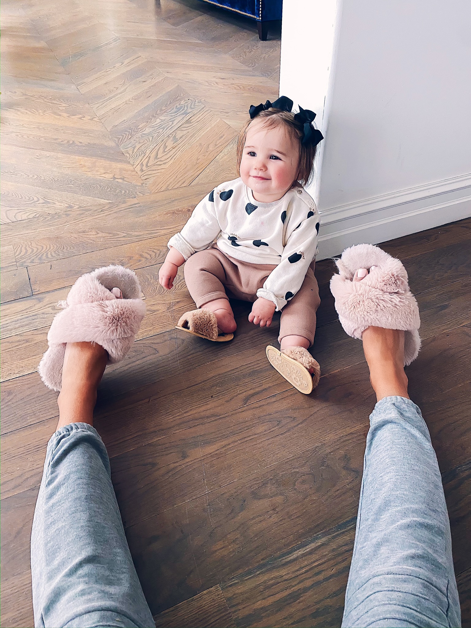 Instagram Recap by popular US lifestyle blog, The Sweetest Thing: image of a mom and daughter sitting on the floor and wearing a Nordstrom Moto Cozy Jogger Pants CHASER, Amazon HALLUCI Women's Cross Band Soft Plush Fleece House Indoor or Outdoor Slippers, Amazon KoroBeauty Hair Bow, and Amazon BLKCERY Baby Sandals for Girls Summer Shoes Faux Fur Slippers.