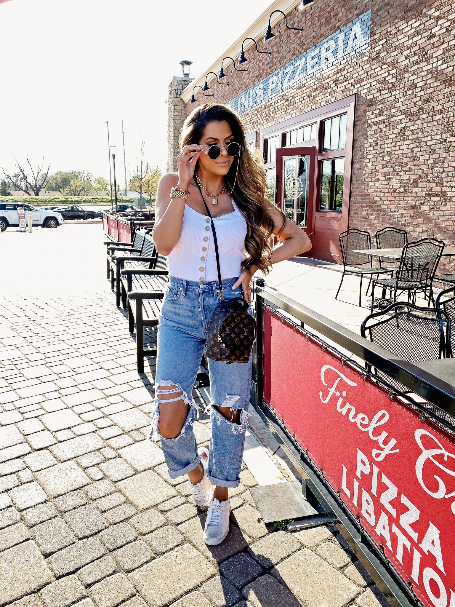  Spring Sales by popular US life and style blog, The Sweetest Thing: image of a woman wearing a Verishop Free People Bridgette Rib Tank, Verishop AGOLDE '90s Mid Rise Loose Fit Jeans, Verishop Lady Grey Jewelry Varie Wrap Necklace, and Verishop Quay Australia Firefly.