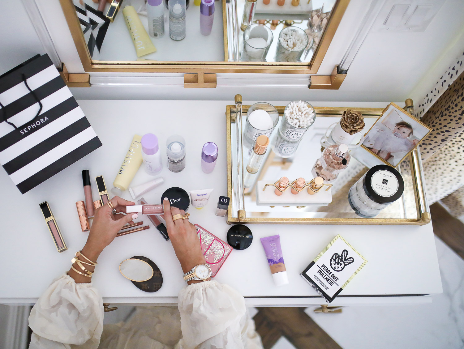 Sephora Haul spring 2020, beauty bloggers, Tatcha Liquid Silk Canvas review, lawless makeup review, emily gemma | Sephora Favorites by popular US beauty blog, The Sweetest Thing: image of a vanity with a Sephora bag and various Sephora makeup products on it. 