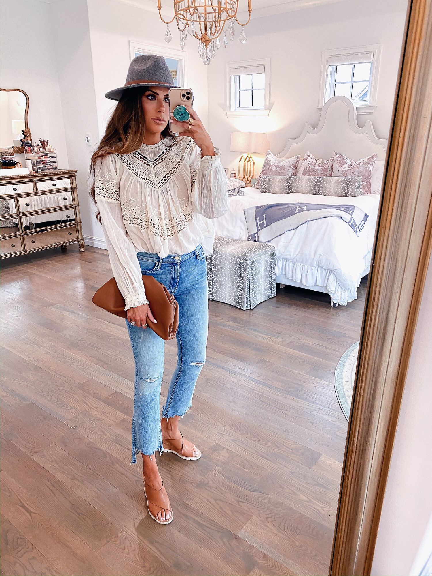 Instagram Recap by popular US lifestyle blog, The Sweetest Thing: image of Emily Gemma wearing a Free People top, Nordstrom Mother The Insider Ripped Chew Hem Crop Bootcut Jeans, PORT BUTTON STUD EARRINGS, Free People Wythe Leather Band Felt Hat, Nordstrom Pillow Talk Lip Cheat Lip Liner CHARLOTTE TILBURY, Nordstrom Hot Lips Lipstick CHARLOTTE TILBURY, Nordstrom Gloss Luxe Moisturizing Lipgloss TOM FORD, Steve Madden FLORETTA COGNAC LEATHER wedges, and holding a Net-A-Porter BOTTEGA VENETA The Pouch small gathered leather clutch.