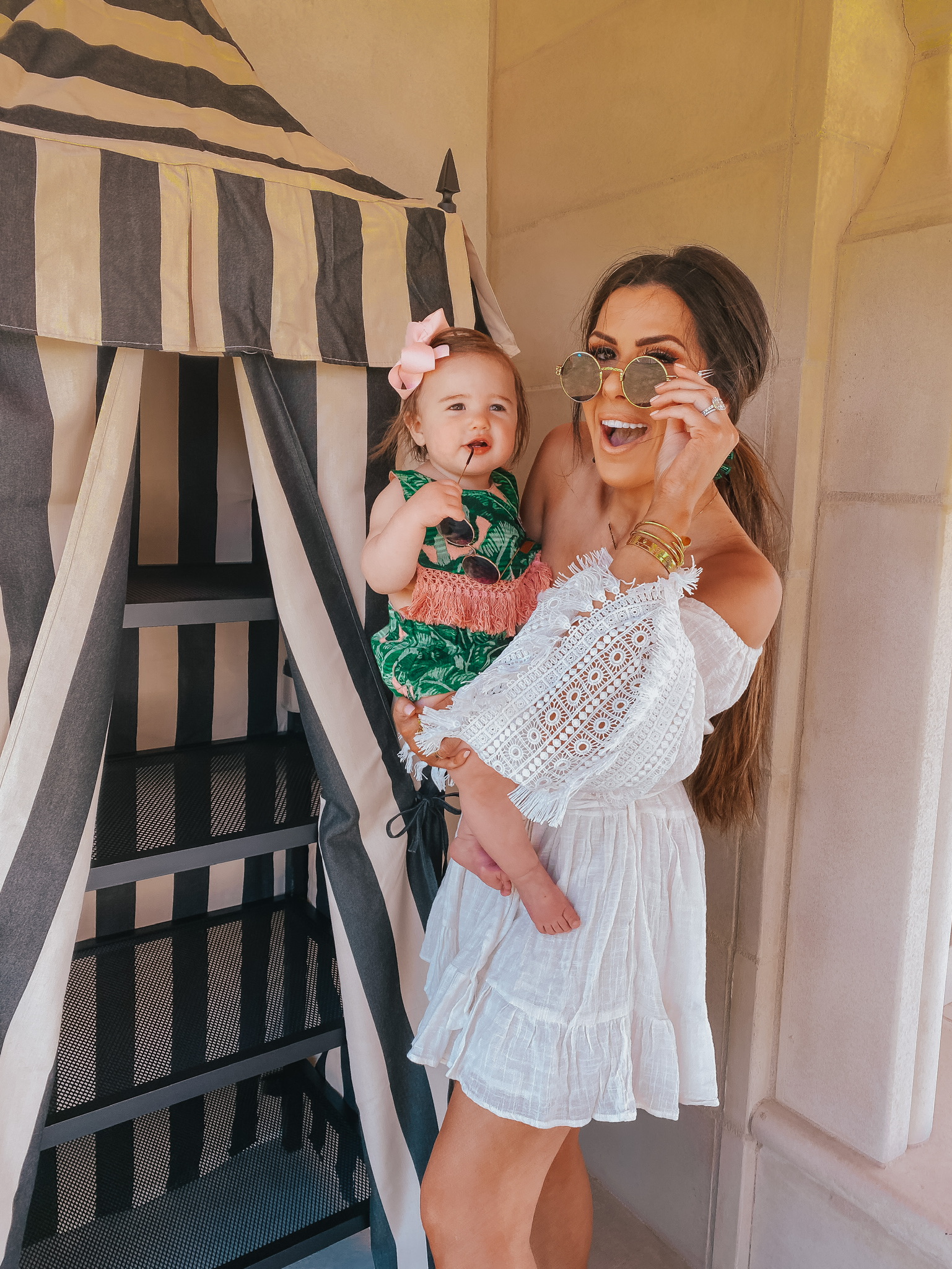 Instagram Recap by popular US lifestyle blog, The Sweetest Thing: image of Emily Gemma holding her daughter and wearing a Red Dress She's The One Ivory Eyelet Lace Dress, Judith March PALM SPRINGS DREAM STATEMENT EARRING, Nordstrom 48mm Round Metal Sunglasses BP., Judith March TROOP PALM SPRINGS BIB & DIAPER COVER, Amazon Roll over image to zoom in SA106 Kids Child Size Hippie Round Circle Lens Tie Dye Gradient Metal Sunglasses, and Amazon Korobeauty Hair Bow.