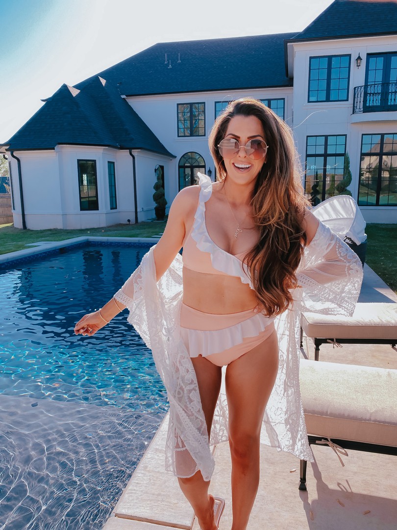 Instagram Recap by popular US life and style blog, The Sweetest Thing: image of Emily Gemma standing by her pool and wearing dior sunglasses, Express white lace cover up, peach and white ruffle bikini, The Styled Collection Love necklace, and Nadri earrings. 