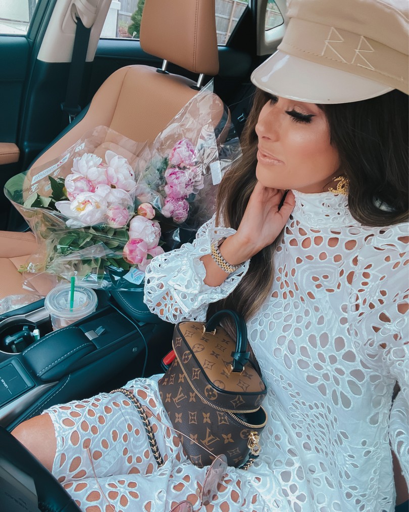 Instagram Recap by popular US life and style blog, The Sweetest Thing: image of Emily Gemma wearing a H&M white eyelet dress, Baker Boy Cap Ruslan Baginskiy, and holding a Louis Vuitton bag. 