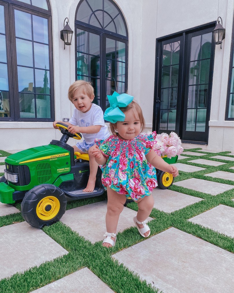 Instagram Recap by popular US life and style blog, The Sweetest Thing: image of Emily Gemma's son riding a Target John Deer tractor and her daughter Sophie wearing a Smocked Auctions romper .