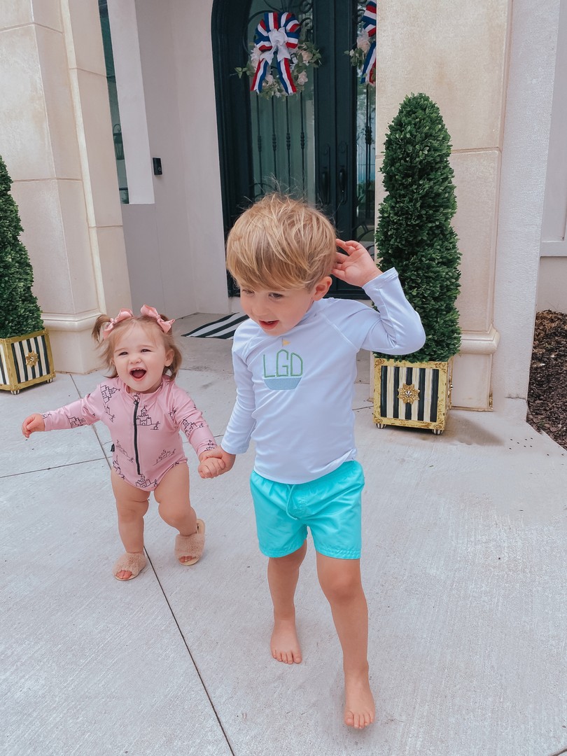Instagram Recap by popular US life and style blog, The Sweetest Thing: image of Emily Gemma's son and daughter holding hands outside while standing next to Mackenzie Childs planters and wearing a Tiny tribe swimsuits