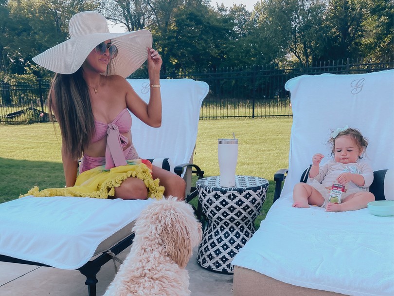  Instagram Recap by popular US life an style blog, The Sweetest Thing: image of Emily Gemma sitting in a lounge chair next to her daughter Sophie who is also sitting in a lounge chair and wearing a Bondi Born Swim Top, Bondi Born Swim bottoms, Dior sunglasses, Chloe necklace, and Smocked Auctions dress. 