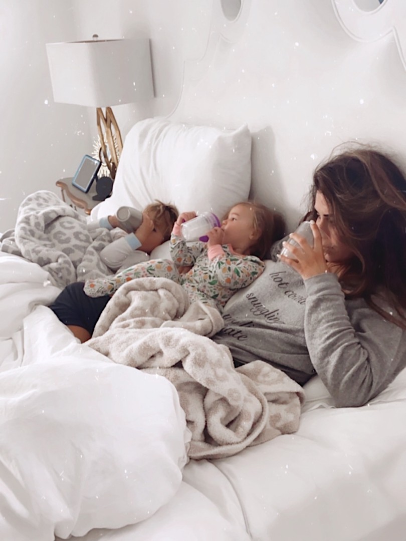  Instagram Recap by popular US life an style blog, The Sweetest Thing: image of Emily Gemma laying in her bed with her two kids on a Concierge Collection mattress topper, Northern Lights pillows, and Barefoot Dreams blankets. 