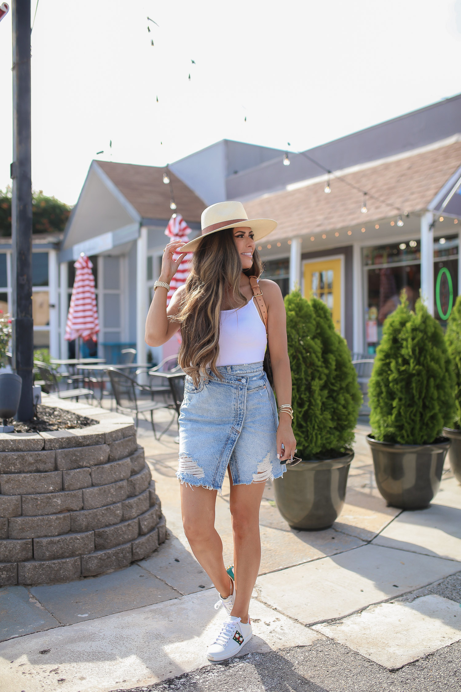 Free People parker wrap denim mini skirt, gucci womens new ace sneaker, rag & bone straw hat, emily ann gemma, summer fashion pinterest 2020, tulsa fashion blogger-2 | Instagram Recap by popular US life an style blog, The Sweetest Thing: image of Emily Gemma standing outside and wearing a Free People parker wrap denim mini skirt, gucci womens new ace sneaker, and rag & bone straw hat.
