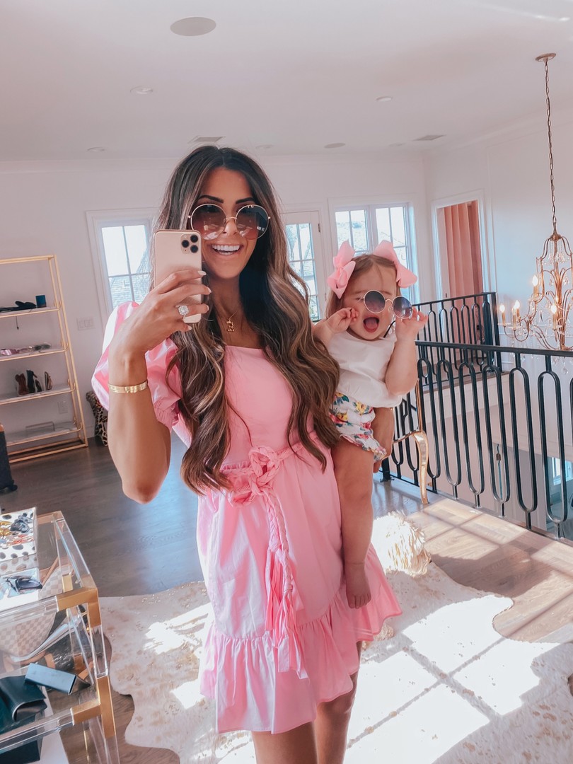  Instagram Recap by popular US life an style blog, The Sweetest Thing: image of Emily Gemma holding her daughter Sophie in her Two story closet and wearing a English Factory dress, Dior sunglasses, and Chloe necklace. 
