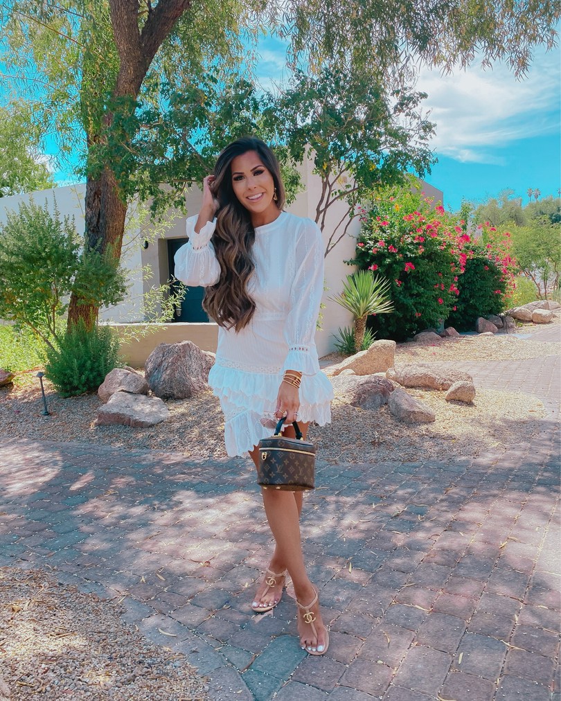  Instagram Recap by popular US life an style blog, The Sweetest Thing: image of Emily Gemma standing outside and wearing a OPT white dress, Chanel sandals, Cartier bracelet, Rolex watch, and holding a Louis Vuitton bag. 