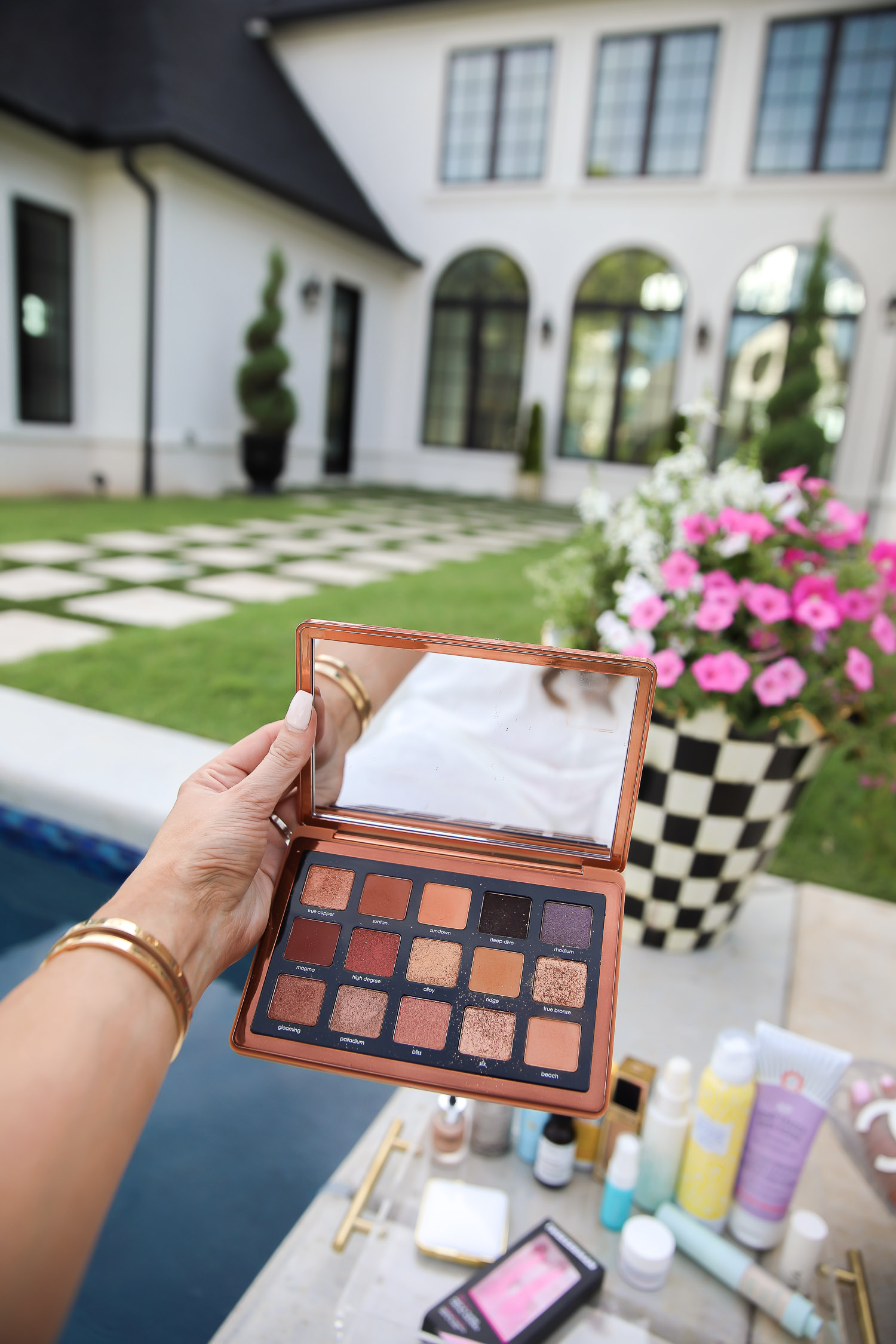 sephora haul beauty blogger july 2020, natasha denona bronze palette review, best dry shampoo at sephora, tarte SPF powder, emily gemma house | Sephora Favorites by popular US beauty blog, The Sweetest Thing: image of Emily Gemma holding a eyeshadow pallet. 