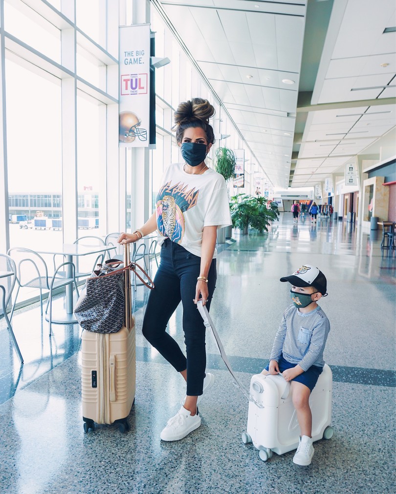 Travel Outfits, Jetkids, Cute Face masks, NSALE 2020, Nordstrom Sale Outfits, Emily Ann Gemma |Instagram Recap by popular US life and style blog, The Sweetest Thing: image of Emily Gemma with her son at the airport and wearing a Daydreamer t-shirt, Steve Madden sneakers, Slip face mask and Lana Jewelry earrings and necklace. 