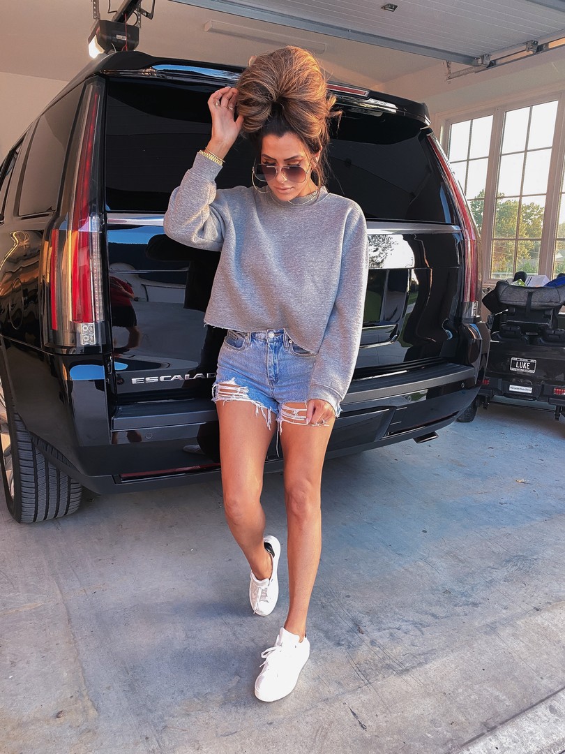 Fall transition outfits, Best of NSALE 2020, Casual outfits, Emily Ann Gemma |Instagram Recap by popular US life and style blog, The Sweetest Thing: image of Emily Gemma wearing a pair of Steve Madden sneakers, Top Shop sweatshirt, and BlankNYC shorts. 
