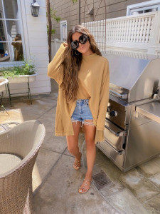 summer fashion 2020, free people, beach outfits, Emily Ann Gemma |Instagram Recap by popular US life and style blog, The Sweetest Thing: image of Emily Gemma wearing a BlankNYC top, cutoff denim shorts and studded sandals. 