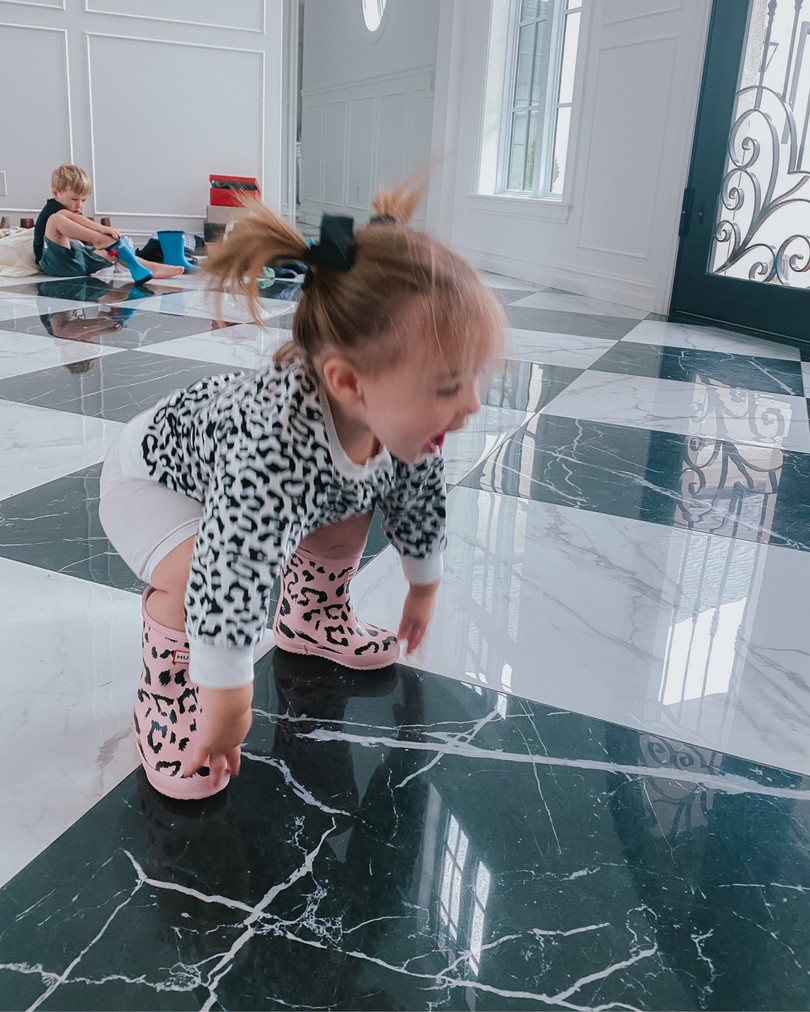 NSALE 2020, Baby outfits, Hunter Rain Boots, Emily Ann Gemma |Instagram Recap by popular US life and style blog, The Sweetest Thing: image of a little girl wearing a black and white leopard print top and pink and black leopard print Hunter boots. 