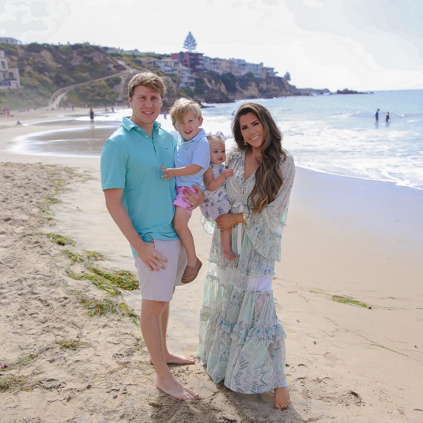 Instagram Recap by popular US lifestyle blog, The Sweetest Thing: image of Emily Gemma and her husband and kids standing together in the sand next to the ocean. 
