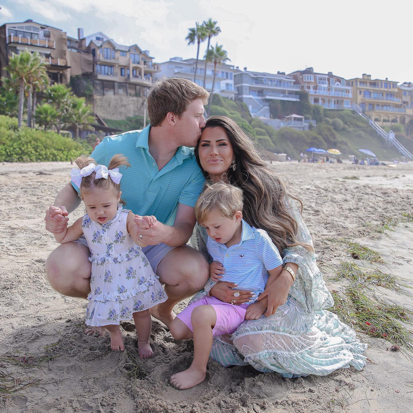 Instagram Recap by popular US lifestyle blog, The Sweetest Thing: image of Emily Gemma and her husband and kids kneeling together in the sand at the beach. 