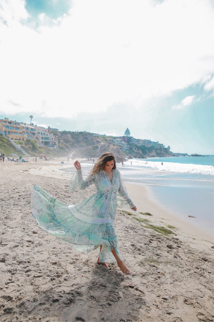 Instagram Recap by popular US lifestyle blog, The Sweetest Thing: image of Emily Gemma wearing a Free People dress and walking in the sand next to the ocean. 