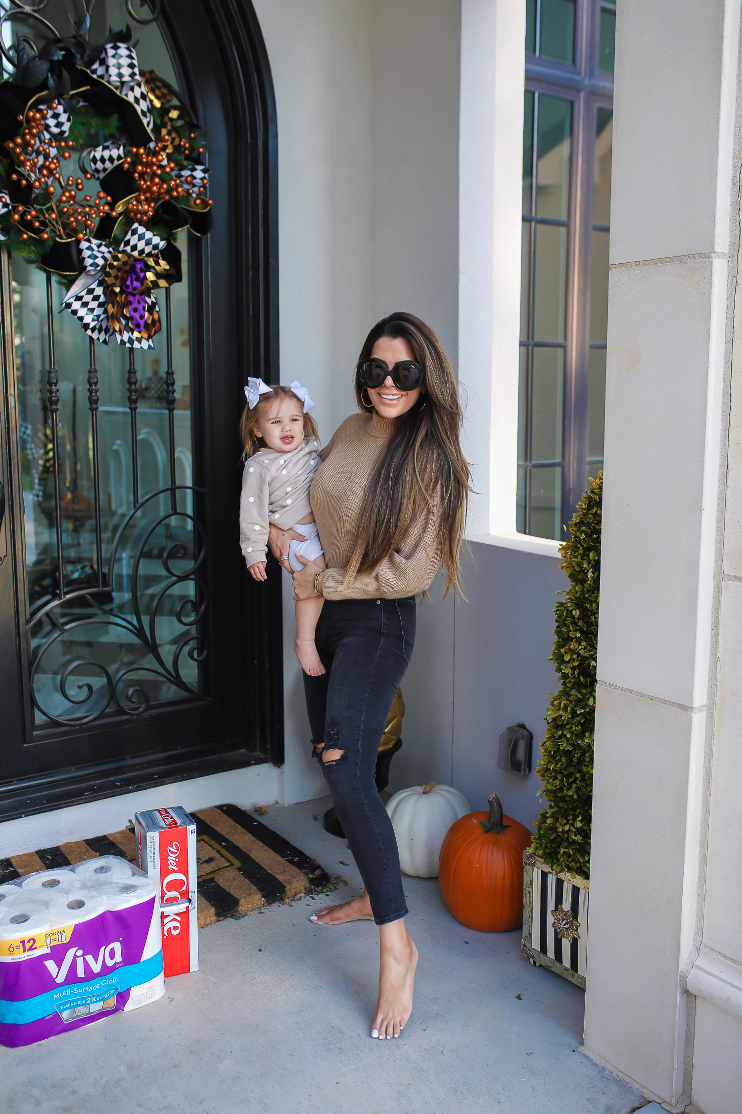 walmart online pickup and delivery review, easiest way to order groceries online, walmart online grocery order, emily ann gemma | Walmart Grocery Pickup Faq by top US lifestyle blog, The Sweetest Thing: image of Emily Gemma holding her daughter Sophie and standing next to a package of Viva toilet paper and a case of Diet Coke. 