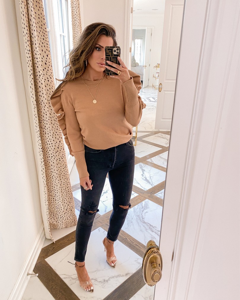 Instagram Recap by popular US lifestyle blog, The Sweetest Thing: image of Emily Gemma wearing a tan ruffle sleeve sweater, black Agolde jeans, Styled Collection earrings, and Gianvito Rossi heeled sandals. 