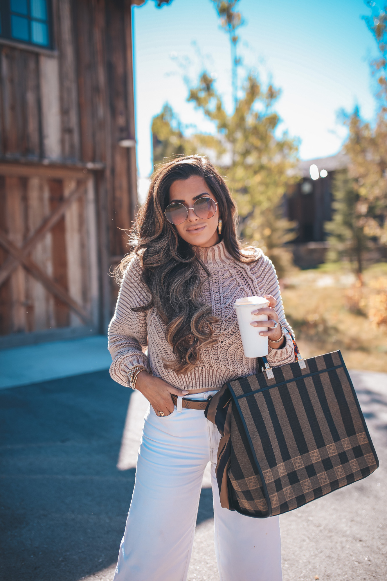 Louis vuitton iconic belt reversible, Fendi Sunshine shoper tote with silk strap, emily gemma |Fall Clothing by popular US fashion blog, The Sweetest Thing: image of a woman wearing a Nordstrom Sweetheart Mock Neck Sweater FREE PEOPLE, H&M Culotte High Ankle Jeans, Rolex Watch, Gianvito Rossi Stark Leopard-Print Leather & PVC Sandals,FENDI SUNSHINE LARGE, Louis Vuitton belt, Fendi STRAP YOU Silk shoulder strap,Dior DiorSociety2F 60MM Round Sunglasses, and holding a phone in a IPHONE 11 PRO CASE.