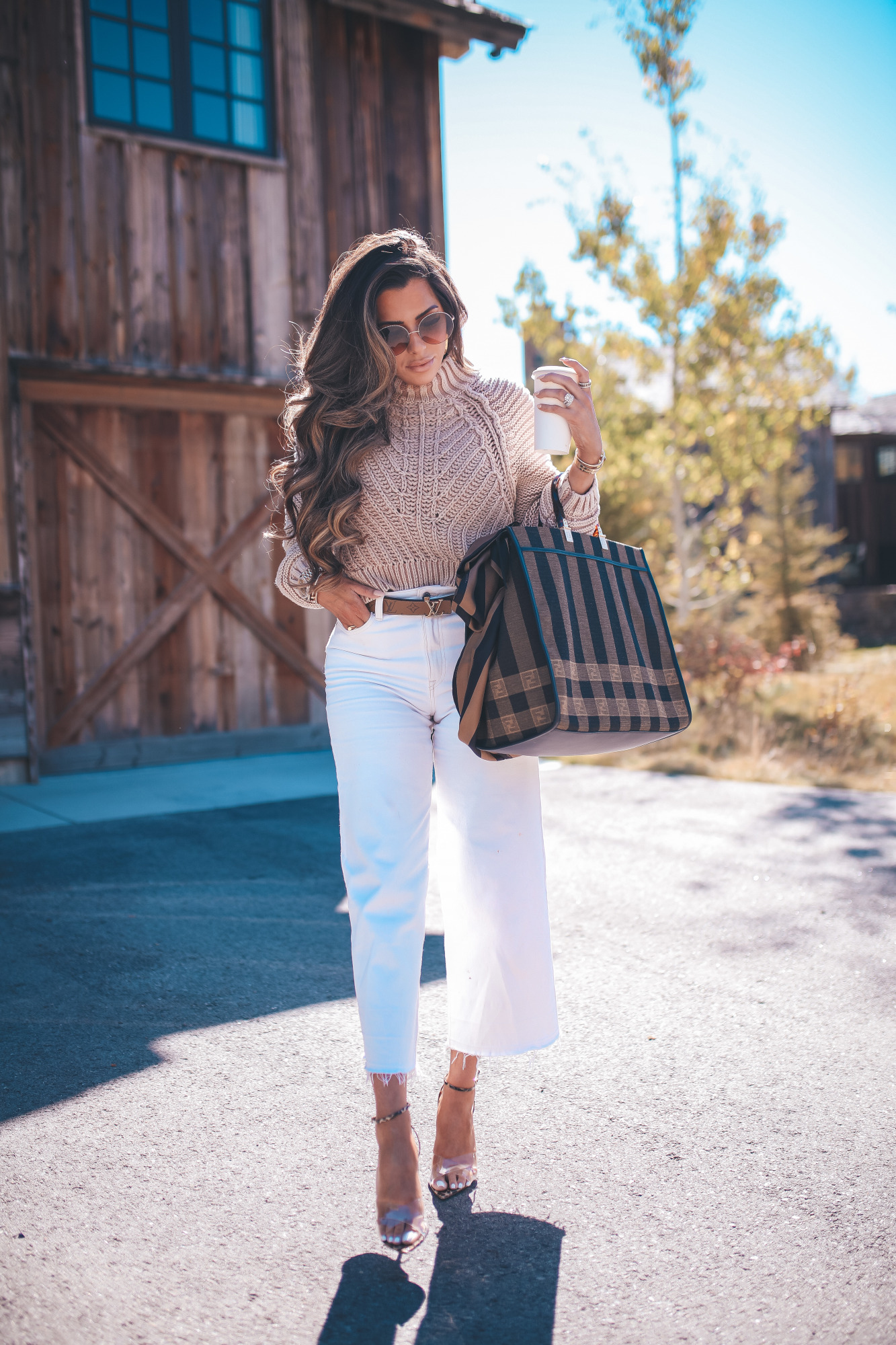 fall fashion outfits 2020 pinterest, Fendi Sunshine shoper tote with silk strap, emily gemma5 |Fall Clothing by popular US fashion blog, The Sweetest Thing: image of a woman wearing a Nordstrom Sweetheart Mock Neck Sweater FREE PEOPLE, H&M Culotte High Ankle Jeans, Rolex Watch, Gianvito Rossi Stark Leopard-Print Leather & PVC Sandals,FENDI SUNSHINE LARGE, Louis Vuitton belt, Fendi STRAP YOU Silk shoulder strap,Dior DiorSociety2F 60MM Round Sunglasses, and holding a phone in a IPHONE 11 PRO CASE.