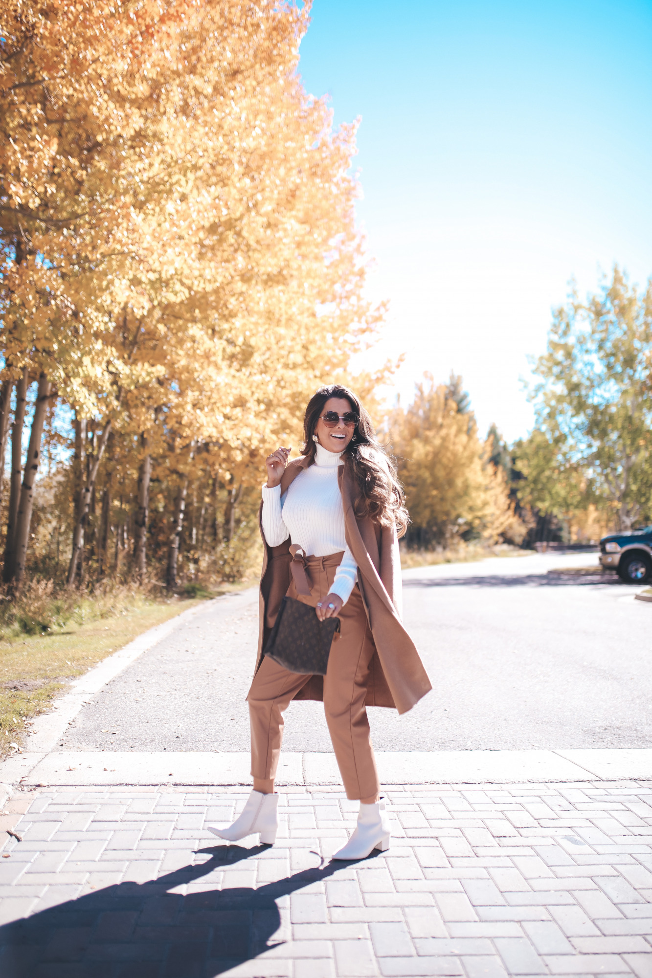 fall fashion outifit ideas pinterest 2020, fall fashion express 2020, fall outfits white booties, emily gemma4 |Fall Outfits by popular US fashion blog, The Sweetest Thing: image of Emily Gemma outside in Jackson Hole and wearing a Express Wide Ribbed Turtleneck Sweater, Express Super High Waisted Vegan Leather Belted Ankle Pant, Express Snakeskin Textured Block Heel Booties, Express Small Twisted Hoop Earrings, Express Belted Wrap Front Wool Coat and Express Octagon Cut-Out Sunglasses.