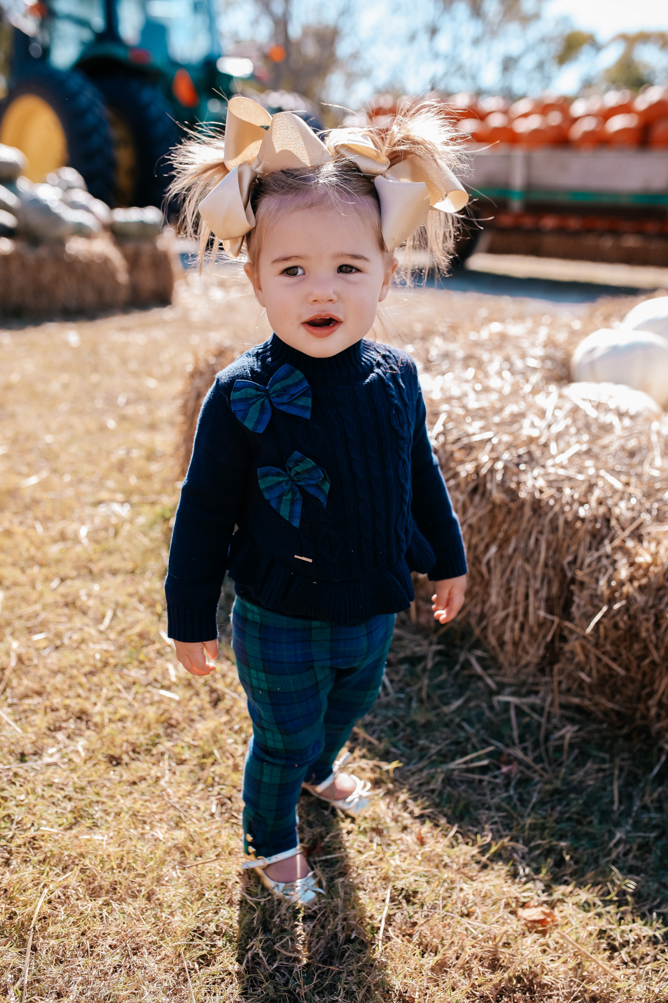 janie and jack kids clothing fall 2020, kids fall fashion 2020, the sweetest thing blog17 |janie and jack kids clothing fall 2020, kids fall fashion 2020, the sweetest thing blog17 | Janie and Jack Kids Clothing by popular US fashion blog, The Sweetest Thing: image of a girl wearing a Janie and Jack PEPLUM BOW SWEATER, Janie and Jack PLAID PONTE BUTTON CUFF PANT, and Janie and Jack METALLIC BOW FLAT.