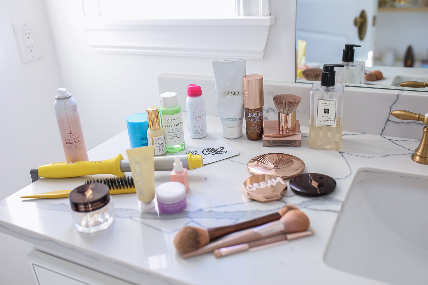 Sephora savings event fall 2020, beauty blogger sephora favorites fall 2020, emily ann gemma |Sephora Beauty Insider Sale by popular US beauty blog, The Sweetest Thing: image of Sephora beauty products products on a bathroom vanity counter. 