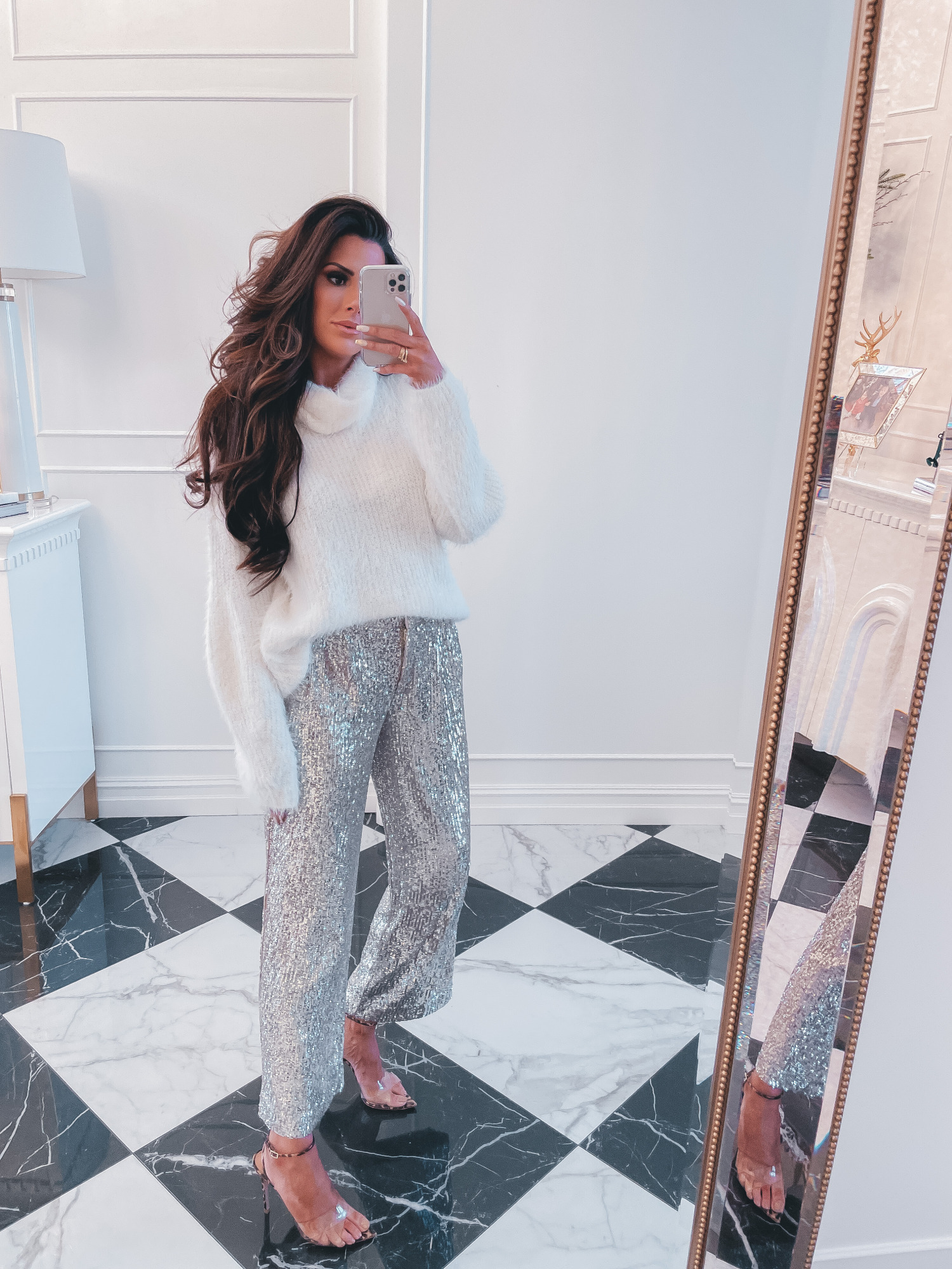 sequin pants, best black friday cyber monday sales 2020, top black friday sales 2020, emily gemma16 | 2020 Black Friday Deals by popular US life and style blog, The Sweetest Thing: image of Emily Gemma wearing a white eyelash turtleneck sweater, sliver sequin pants, and stiletto clear strap sandals.  