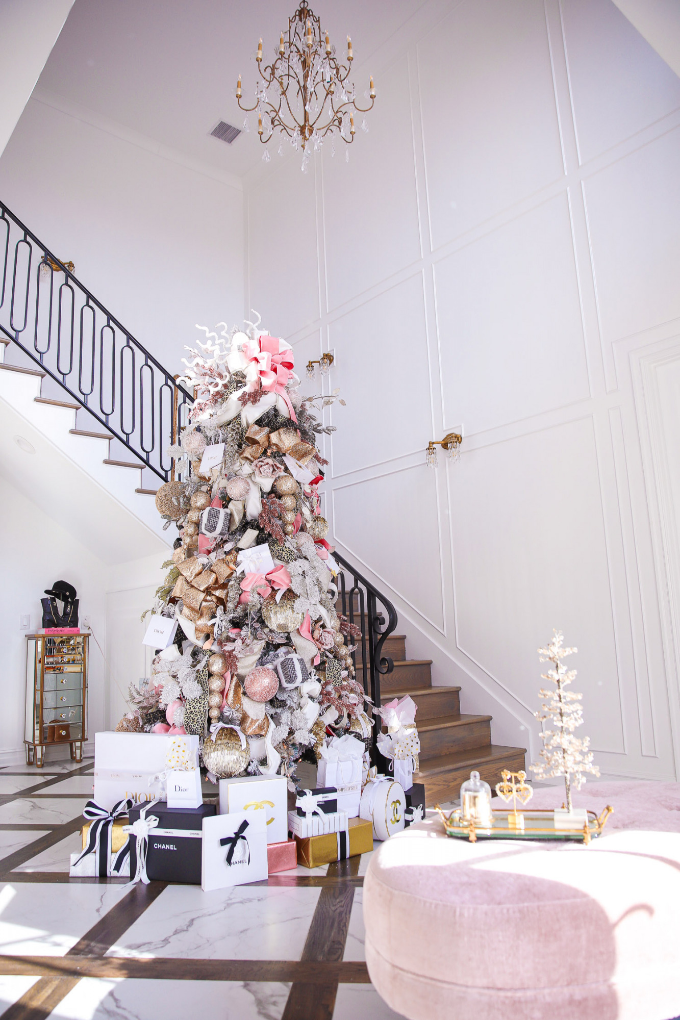 two story closet pinterest, designer chanel christmas tree, unique christmas trees, shop hello holidays, emily gemma christmas tree | Pink and Gold Christmas Tree by popular US life and style blog, The Sweetest Thing: image of a two story closet decorated with pink and gold Christmas Tree with high end retailer bags underneath. 