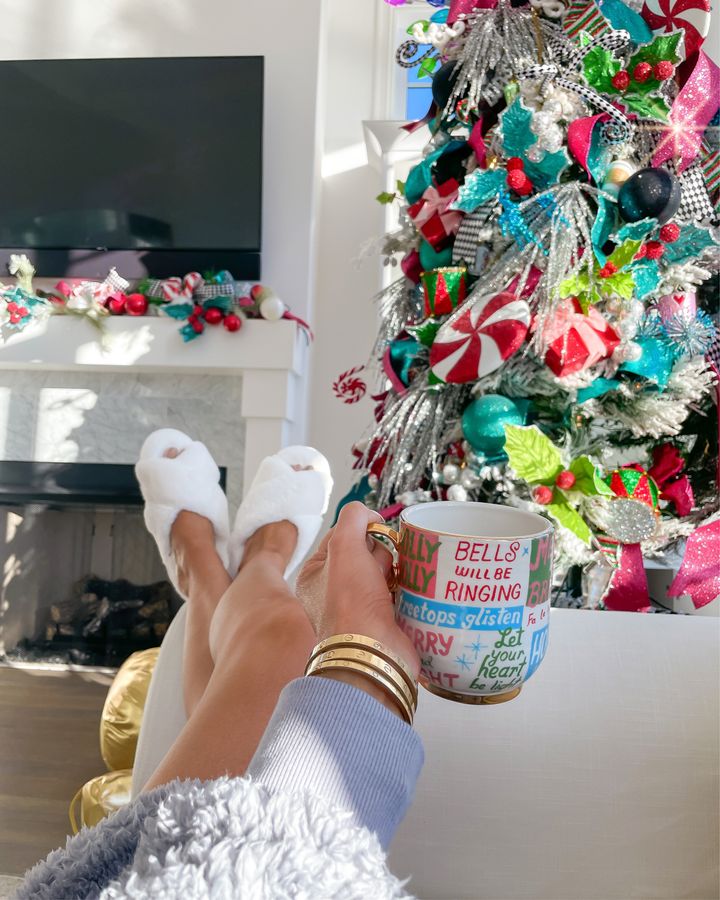 November Instagram Recap by popular US lifestyle blog, The Sweetest Thing: image of Emily Gemma wearing a pair of white fuzzy BP. slippers and holding a Anthropologie Christmas mug. 