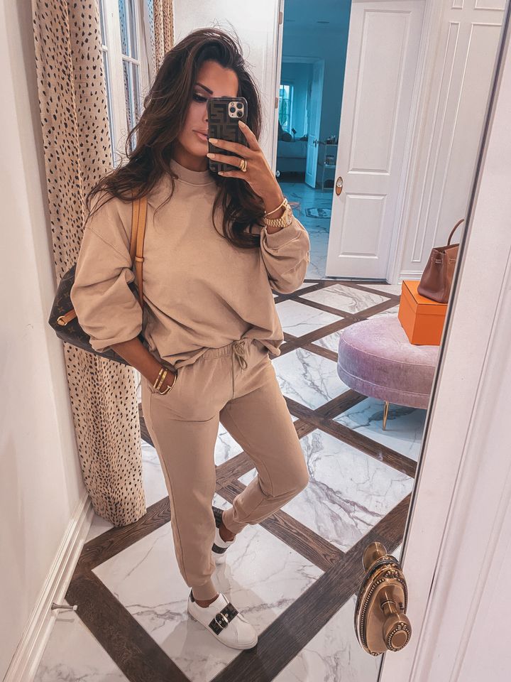 November Instagram Recap by popular US lifestyle blog, The Sweetest Thing: image of Emily Gemma wearing a Buddy Love sweatsuit, Fendi sneakers, and holding a phone in a Fendi case. 