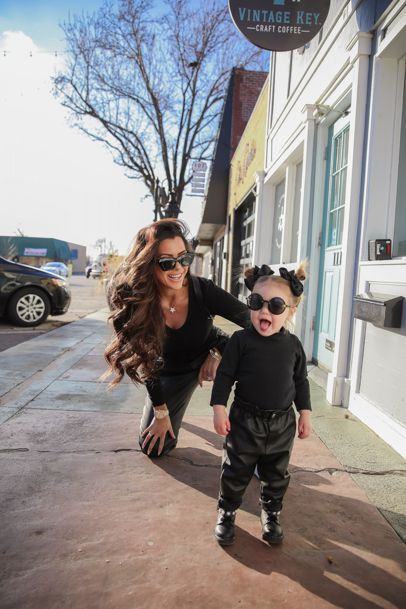 matching mommy daughter fashion outfits Pinterest, Emily Gemma, Nordstrom BP faux leather pants, loewe sunglasses, Alexander mcqueen sneakers gold white outfit pinterest |Mommy and Daughter by popular US fashion blog, The Sweetest Thing: image of a woman and her daughter walking together outside and wearing a pair of BP faux leather pants, Good American top, loewe sunglasses, Alexander mcqueen sneakers, Monica Vinader ring, Nadri bracelet, Nadri earrings, and Rolex watch.