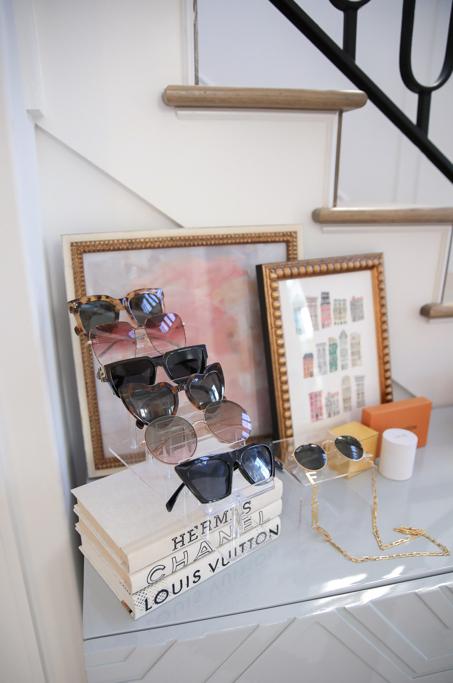 Top Picks by popular US life and style blog, The Sweetest Thing: image of designer sunglasses on acrylic sunglasses stands. 