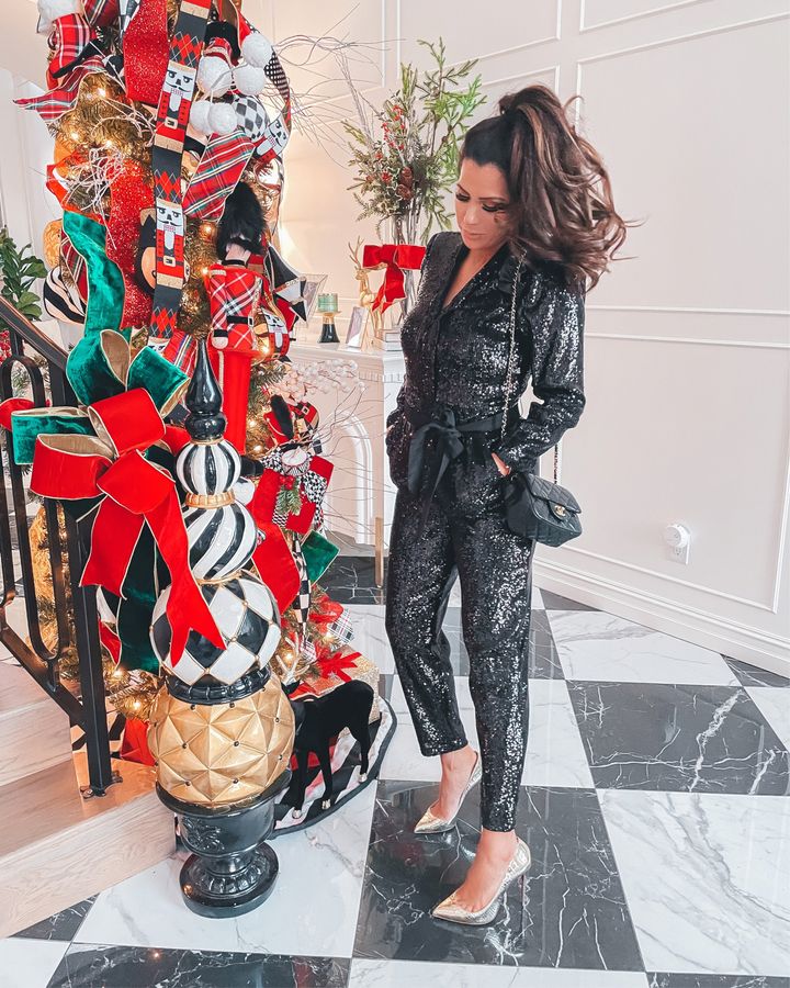 November Instagram Recap by popular US lifestyle blog, The Sweetest Thing: image of Emily Gemma wearing a Express black sequin jumpsuit, Christian Louboutin heels, and a Chanel black purse. 