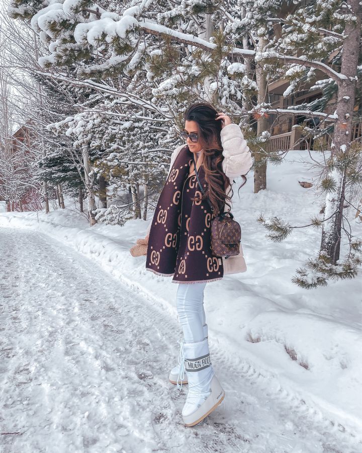 Emily gemma, winter outfit ideas, gucci scarf, how to style moon boots, faux fur coat, white denim, what to wear in the snow, Louis Vuitton Monogram Palm Springs Backpack Mini