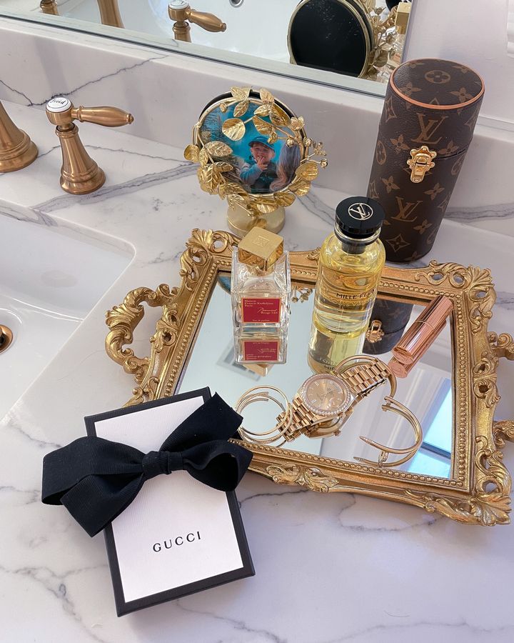 bathroom decor ideas, best perfume 2021, Emily ann gemma home, Louis Vuitton perfume, gold watch, gold earrings, gold floral frame