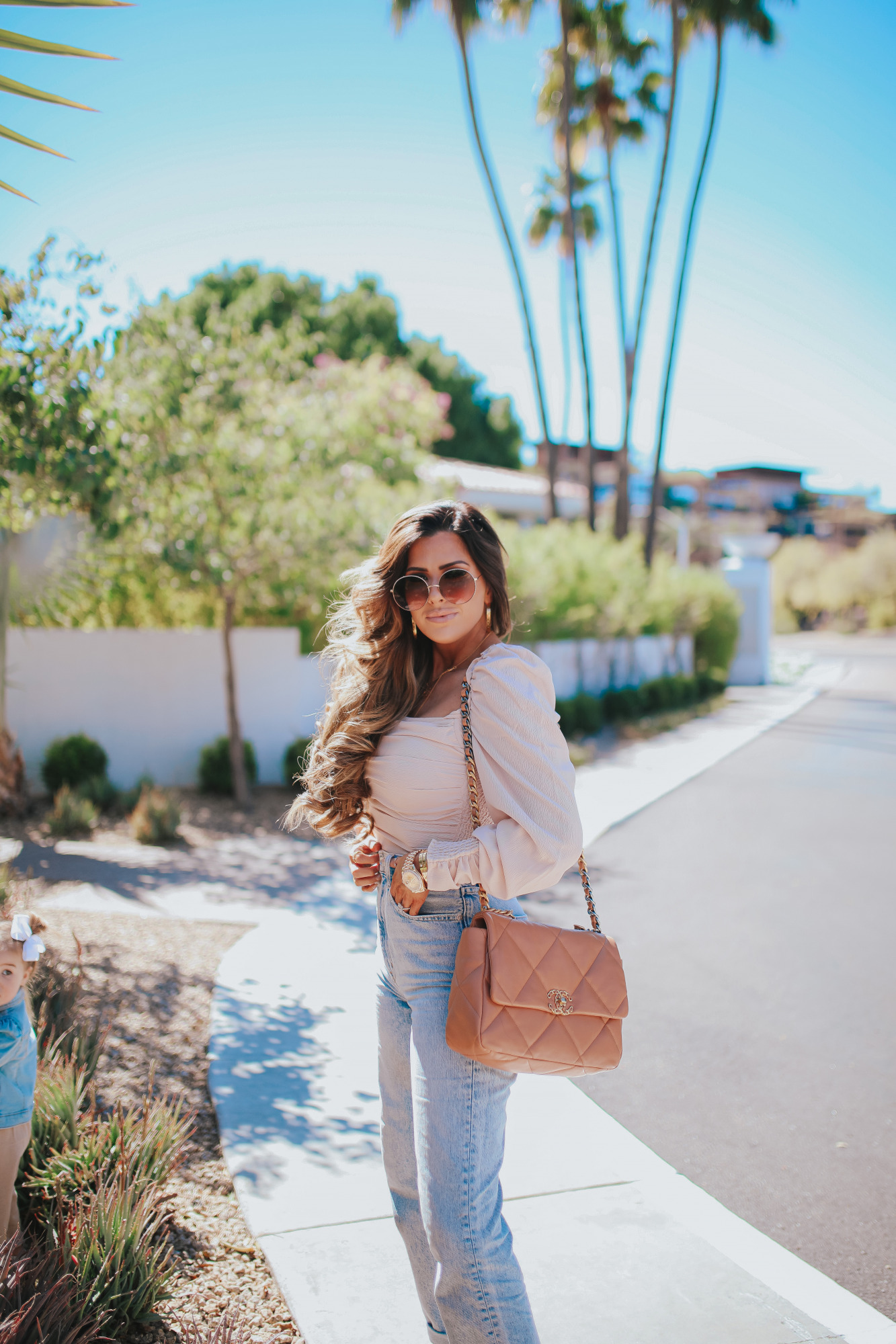 Chanel 19 flap tan brown medium, The Scott Scottsdale hotel, emily gemma, Mom jeans outfit 2021 pinterest1 | Mom Jeans by popular US fashion blog, The Sweetest Thing: image of Emily Gemma at standing outside in Scottsdale, Arizona and wearing Slvrlake mom jeans, Astr the Label top, gold Rolex watch, Cartier rings, Chanel purse, cartier bracelets, and Chanel necklace. 