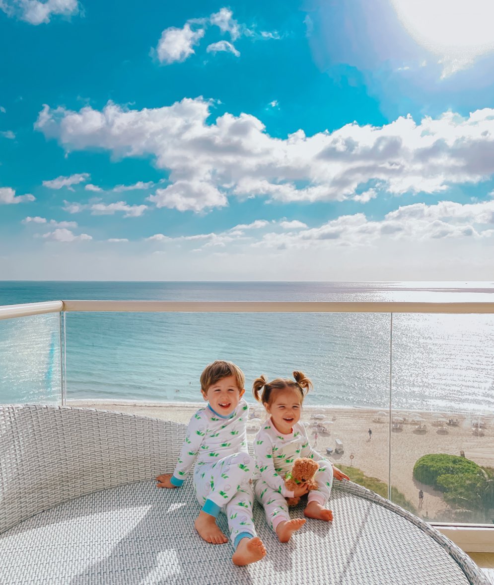 little girls pajamas, toddler pajamas, Little boys pajamas, The Gemma Gang, Golf Pajamas, Smocked Auctions, Sleepwear for kids |Instagram Recap by popular US fashion blog, The Sweetest Thing: image of two kids sitting outside on a balcony and wearing matching Smocked Auctions pajamas. 