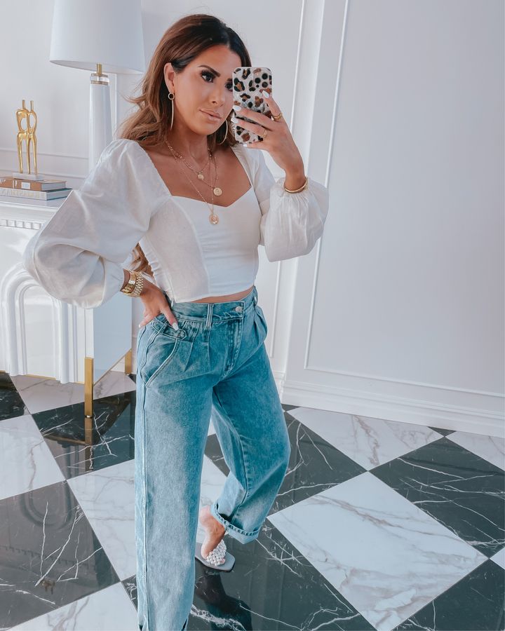 Forever 21 Try On Haul, Affordable Fashion, Mom Jeans, Forever 21, Spring Style, Outfit Ideas with Mom Jeans, Emily Gemma |Instagram Recap by popular US fashion blog, The Sweetest Thing: image of Emily Gemma wearing a Forever 21 white long sleeve crop top, Forever 21 mom jeans, and white woven strap slide sandals. 