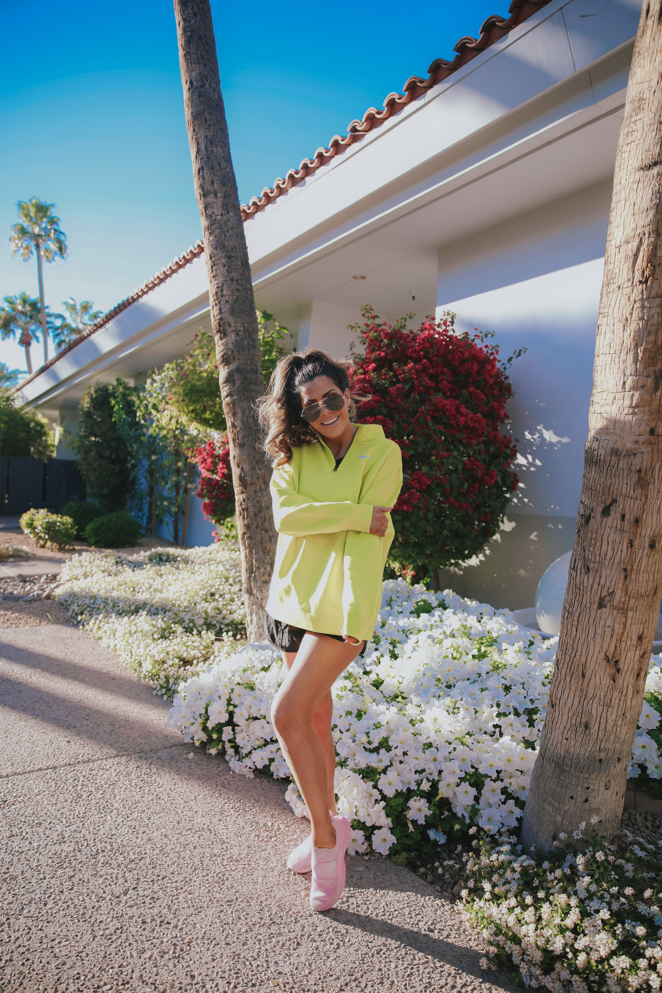 neon nike pullover Emily Gemma, the Scott scottsdale |Instagram Recap by popular US fashion blog, The Sweetest Thing: image of Emily Gemma wearing a neon Nike pullover with pink sneakers. 