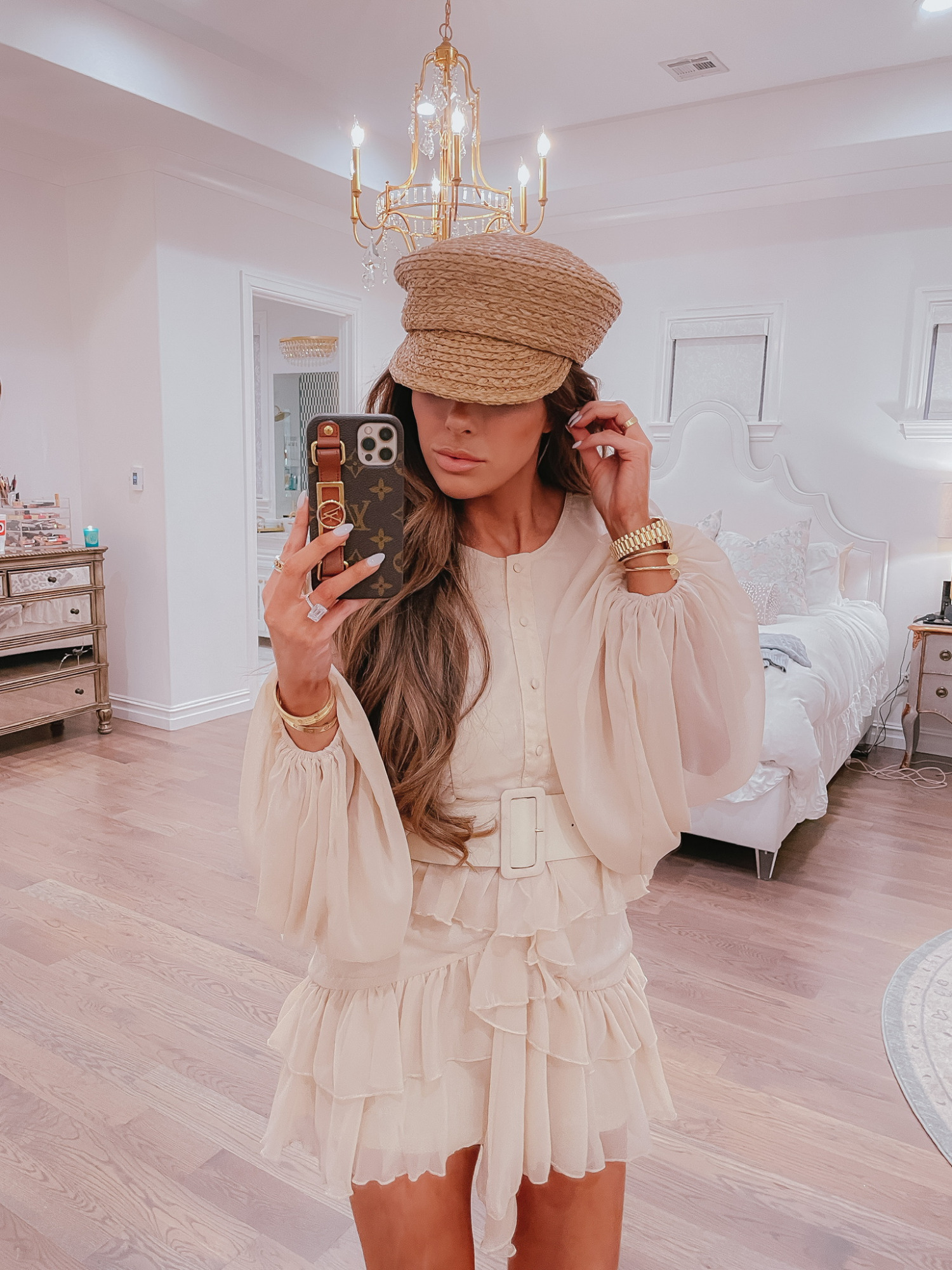 Ruffle Dress, Spring Dress, Cream Dress, Long Sleeved Mini Dress, Belted Dress, Vici Collection, Try-On Haul, Emily Ann Gemma |VICI Fashion by popular US fashion blog, The Sweetest Thing: image of Emily Gemma wearing a VICI tan tiered ruffle skirt belted dress with a straw hat. 