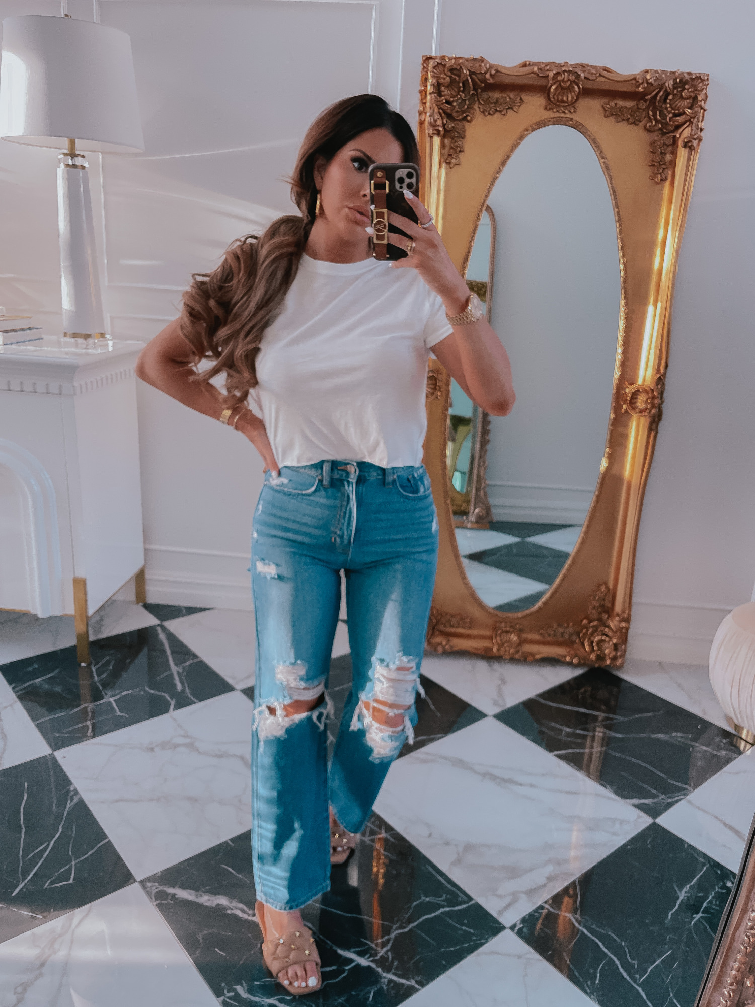 Best Basic White T-Shirt, Ripped Jeans, Spring Outfit Ideas 2021, Nude Sandals, Emily Ann Gemma, Best Closet Basics Spring 2021 |Spring Fashion by popular US fashion blog, The Sweetest Thing: image of Emily Gemma wearing a white t-shirt, distressed denim and tan studded slide sandals. 